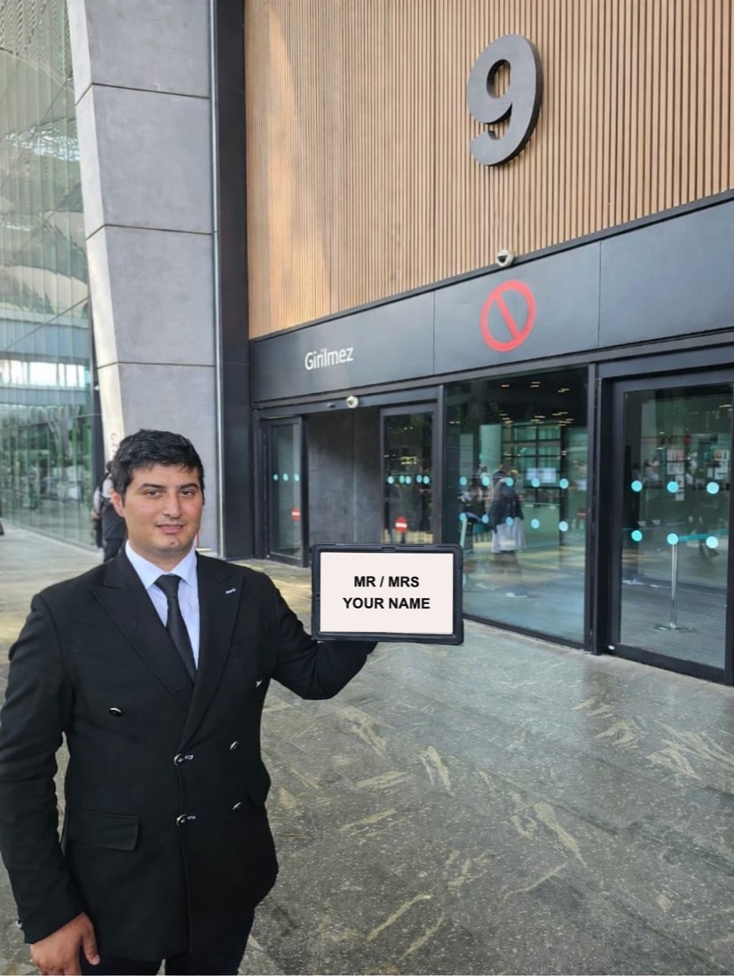 Yusuf, ATUF Travel greeter, waiting at Exit Gate No. 9 of Istanbul Airport with a name sign